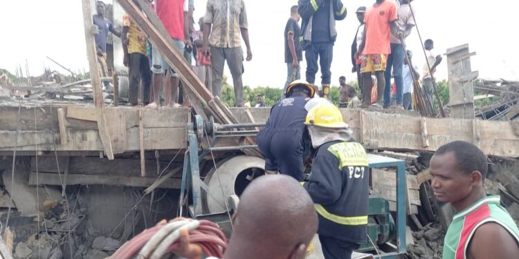 PHOTOS: Four-storey Building Collapses In Abuja, Many Trapped